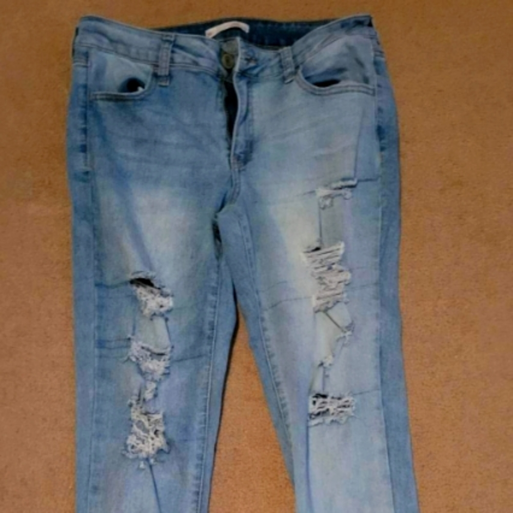 Faded ripped denim jeans